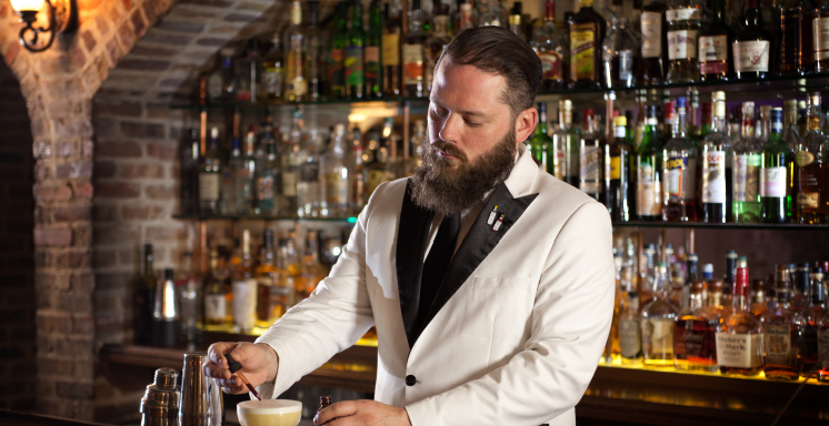 Male bartender mixing a craft cocktail in Savannah