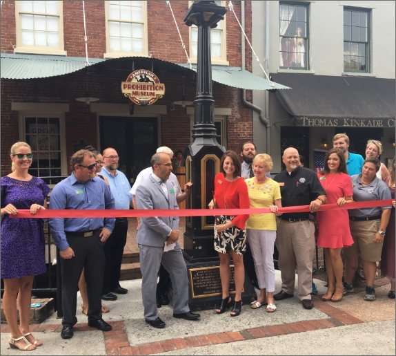 cutting the ribbon at the opening of the american prohibition museum