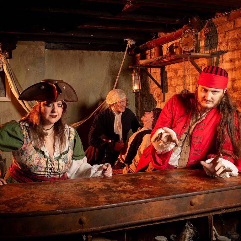 hosts at torture room at Savannah Pirates and Treasure Museum